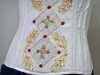 detail of goldwork design on corset made by Gill Roberts