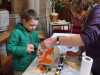 Norma Heron is helping a budding artist at the children's craft afternoon in St. Barnabus Church