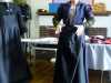 Sarah Thursfield wears a black worsted apron which denotes the she is a "clean servant"