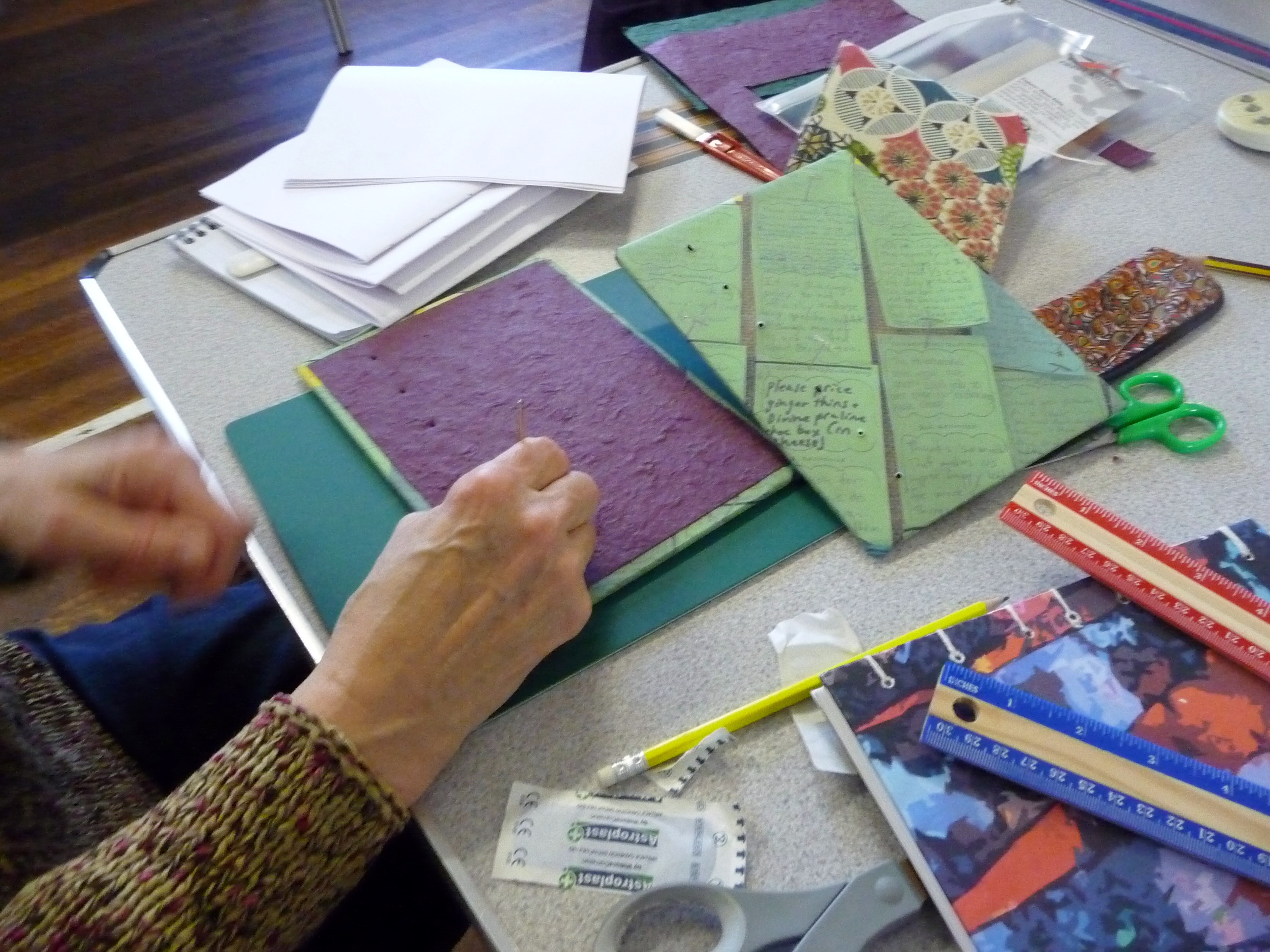 Bookbinding workshop- punching holes for the stitching