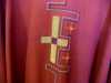 detail of red Vestment worn on Palm Sunday, Good Friday, Pentecost and Martyr's Day. This was made for the Papal Visit 1982