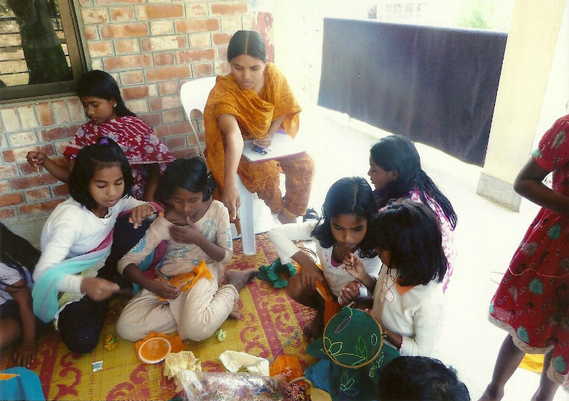 Shabita sewing with the children in Sreepur, Bangladesh, Feb 2013
