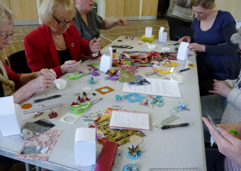 another busy table with brooches nearing completion