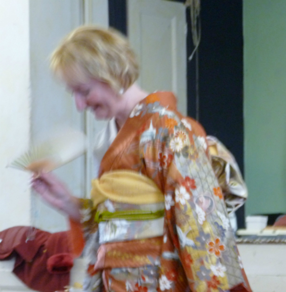 Sarah is quite pleased to have her fan, Wearing a kimono is hot work