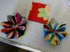some flower brooches which have been glued to the background felt. They must dry before they can be completed