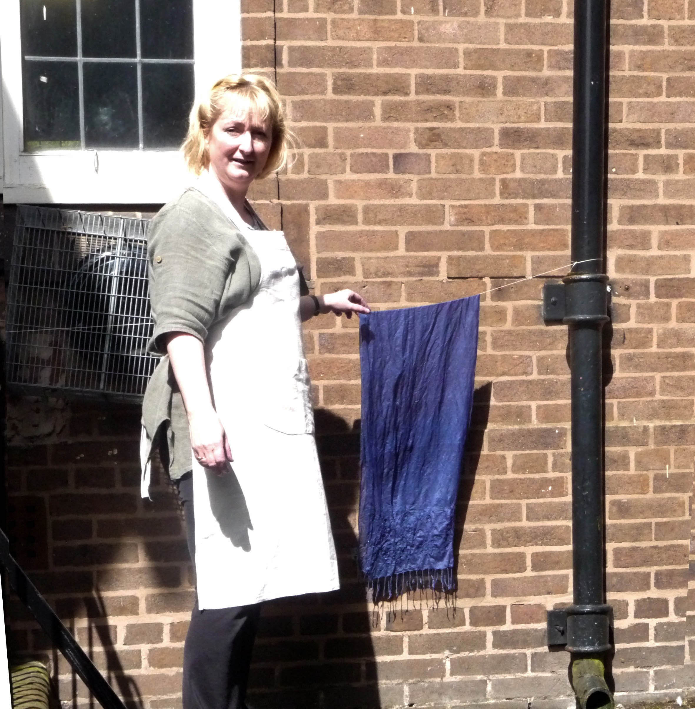 Sarah is enjoying the sunshine while waiting for her Sreepur scarf to dry