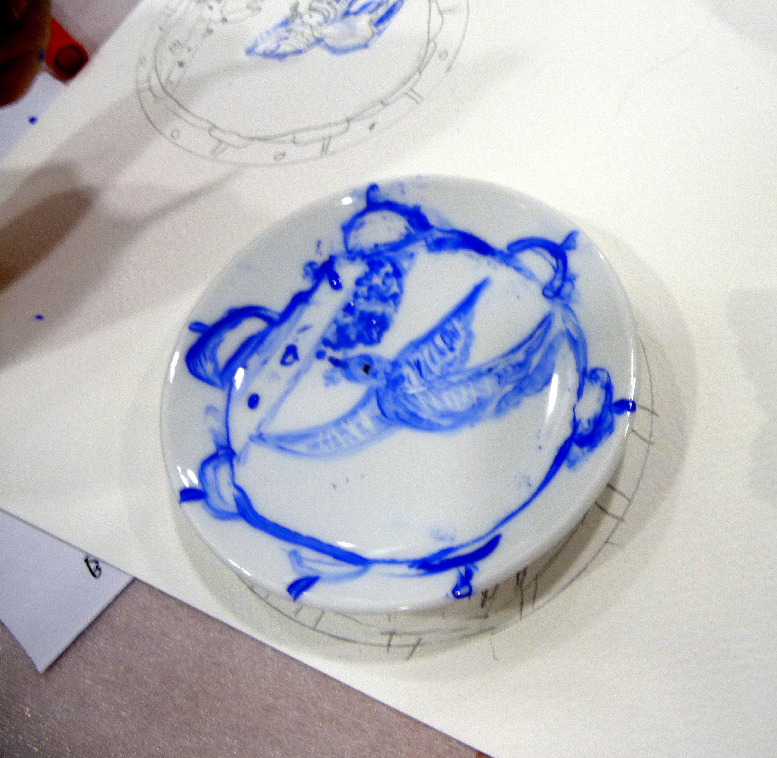 YE painted plates based on the willow pattern design