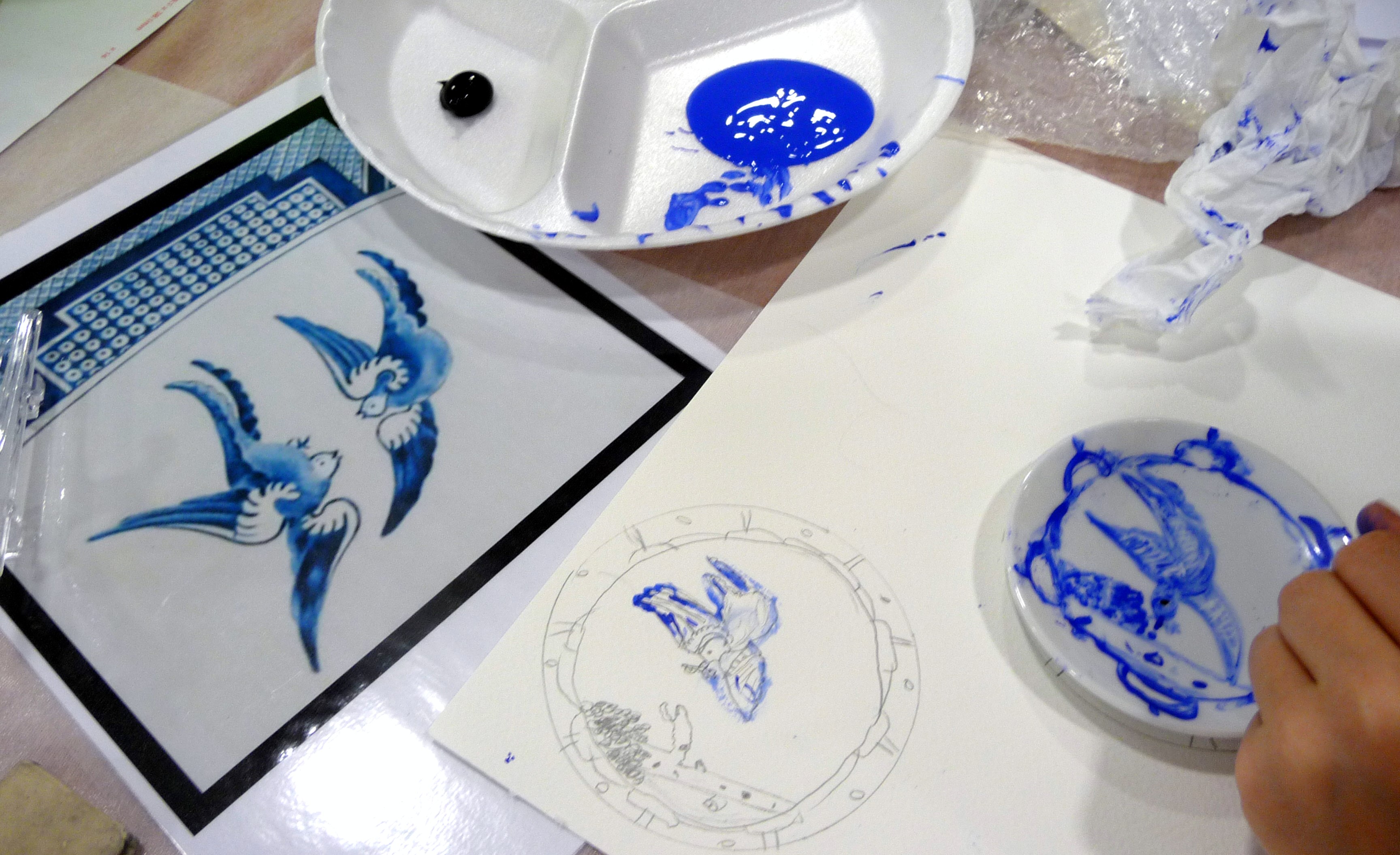 YE painted plates based on the willow pattern design