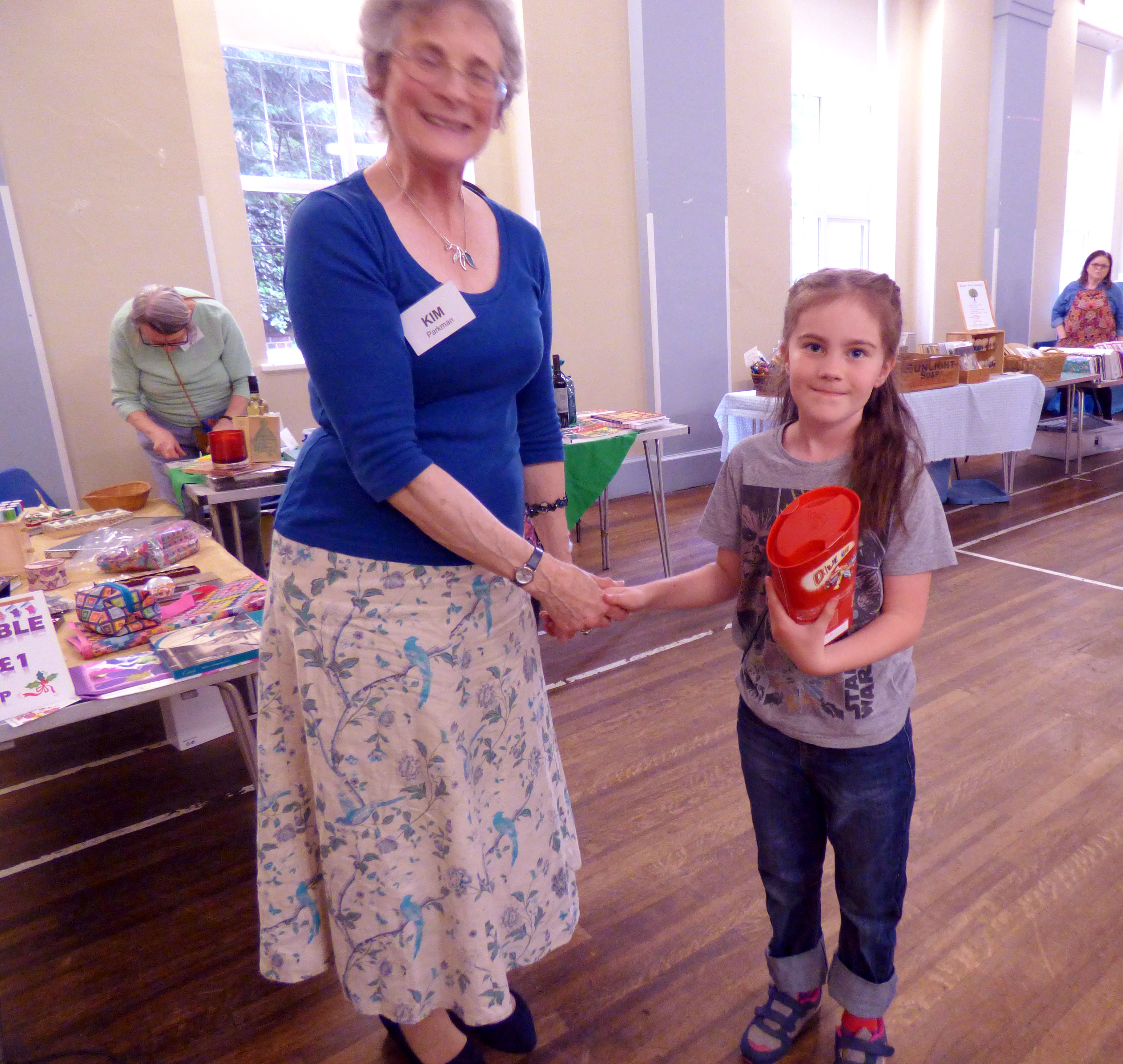 Marla is receiving a prize for her cushion embroidery at MEG Summer Party 2017