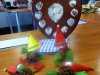 some little elves made from pinecones and the Sreepur shield which is awarded to Merseyside Young Embroiderer of the Year