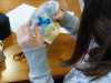 Ruby is stitching her whale in the needlefelted seascape