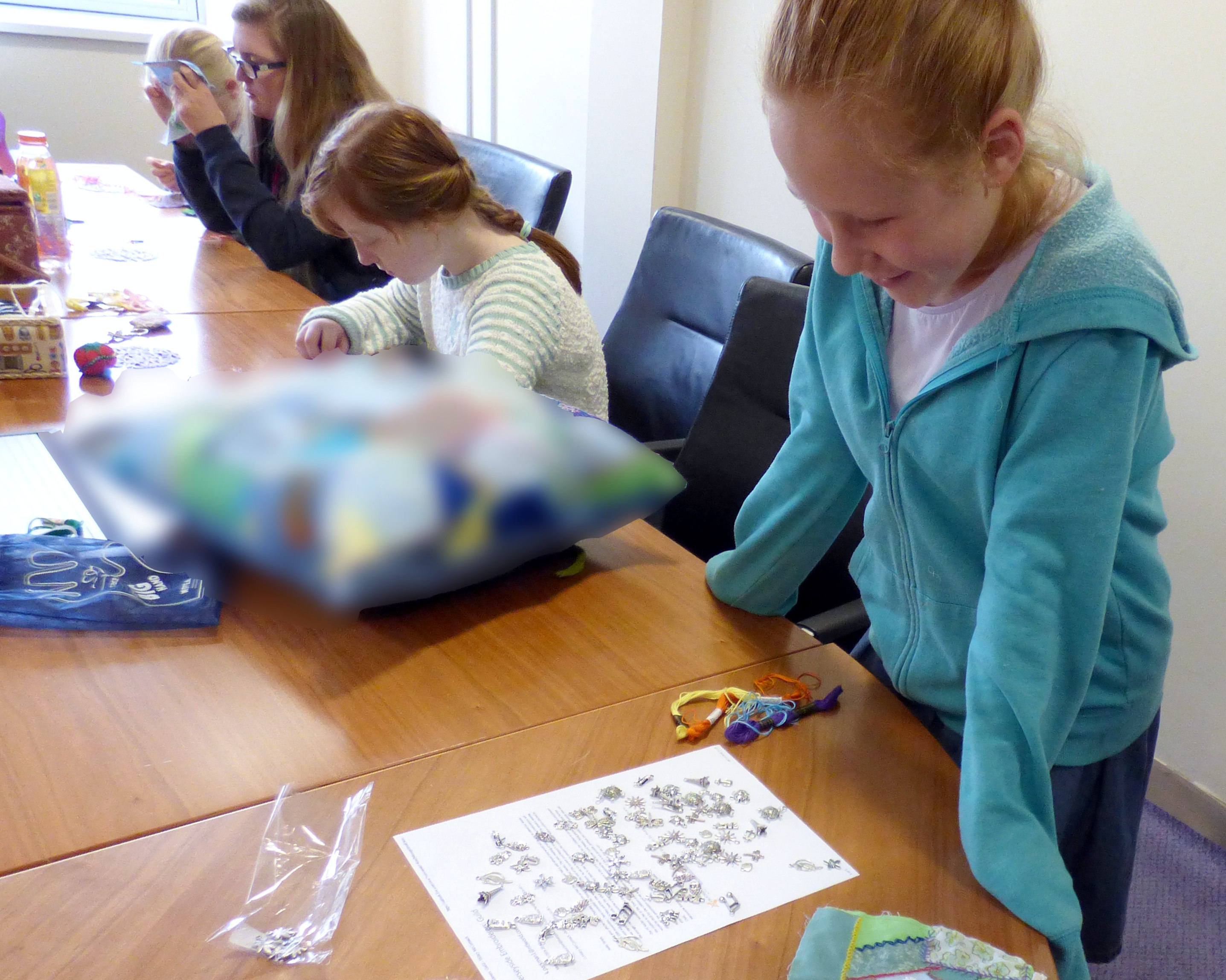 choosing charms for the crazy patchwork bag at YE group , Nov 2016