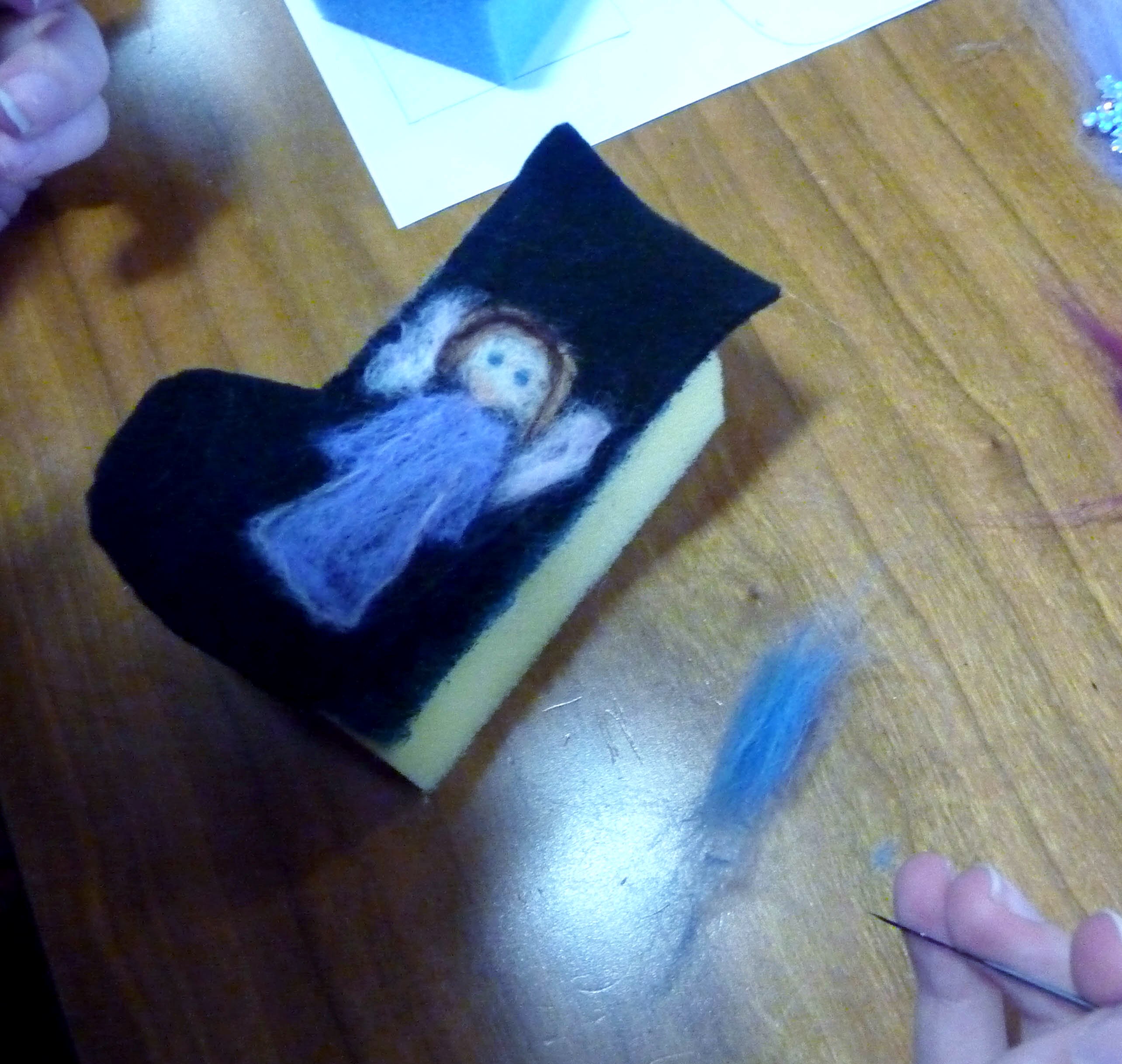 Maisie has needle-felted an angel on her Christmas stocking