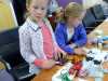 Zoe and Emma are choosing some embellishments for their needle-felted Christmas stockings