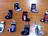 a collection of needle-felted Christmas stockings made by Merseyside YE group