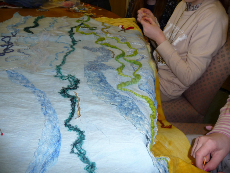 some of the girls working on the WATER embroidery