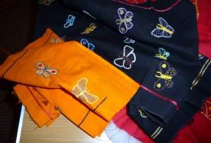 fabrics hand embroidered with butterflies, which will be joined together to make a quilt