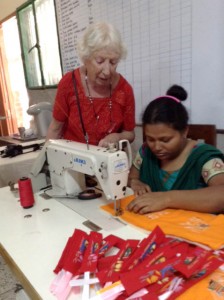 This is Ruby Porter MBE with Parul who is sewing up the bookmarks in Sreepur, Bangladesh, Nov 2014