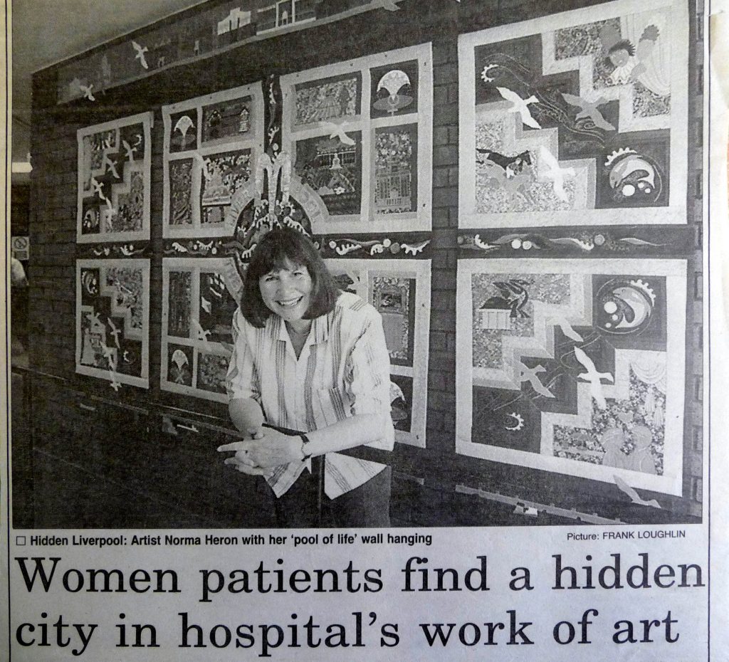 1995 newspaper cutting showing Norma Heron at the launch of her POOL OF LIFE embroidered hanging