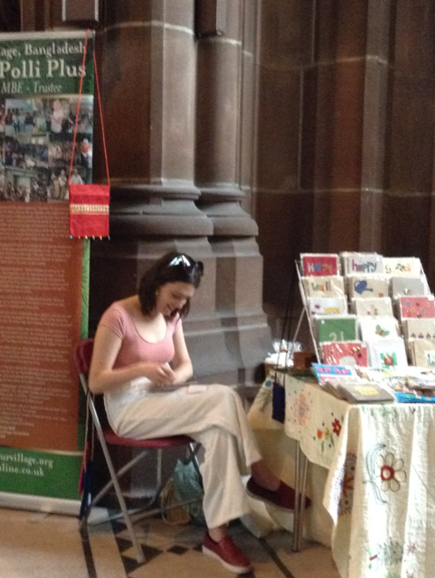 Ruby's granddaughter Finni at Threading Dreams exhibition in Liverpool Cathedral