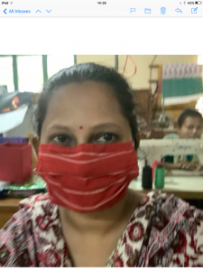 Maya is modelling masks that Parul has made, Sreepur 2020